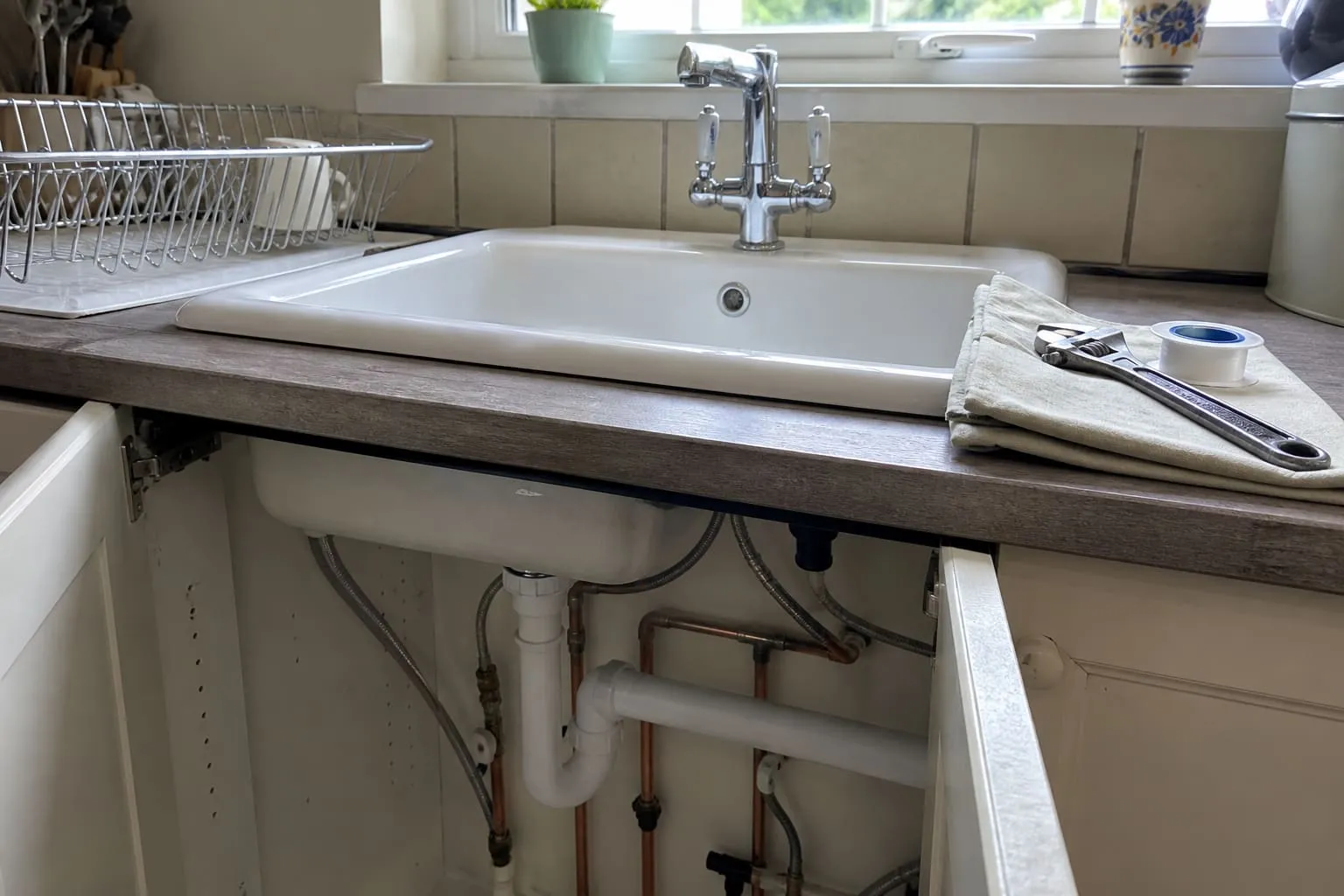 Kitchen sink and mixer tap after a plumbing repair