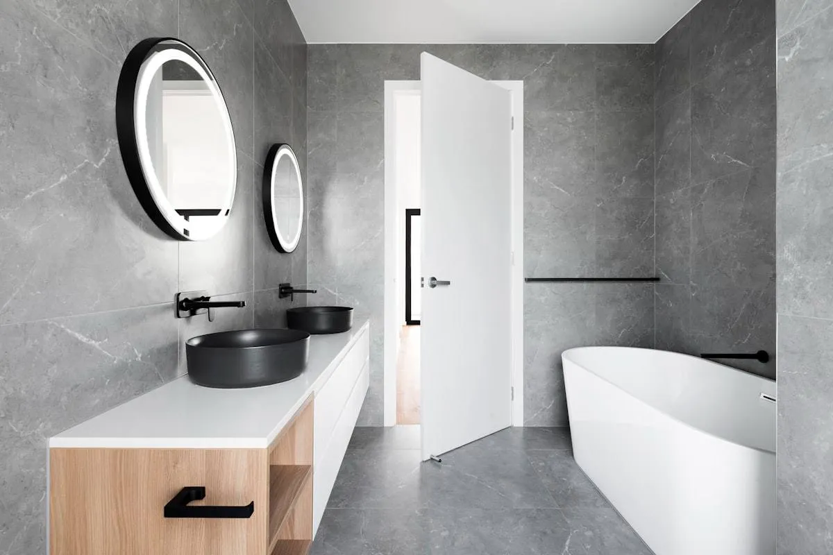Fresh silicone sealant around a bath in a UK bathroom